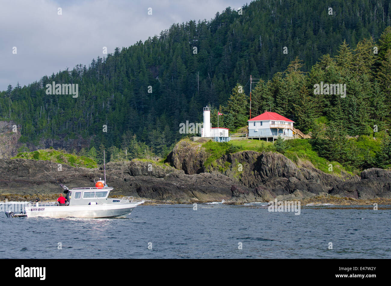 Fishing boat at Quatsino Sound Lighthouse Kains Island Light Station, Port Alice, Vancouver Island, British Columbia, Canada. Stock Photo