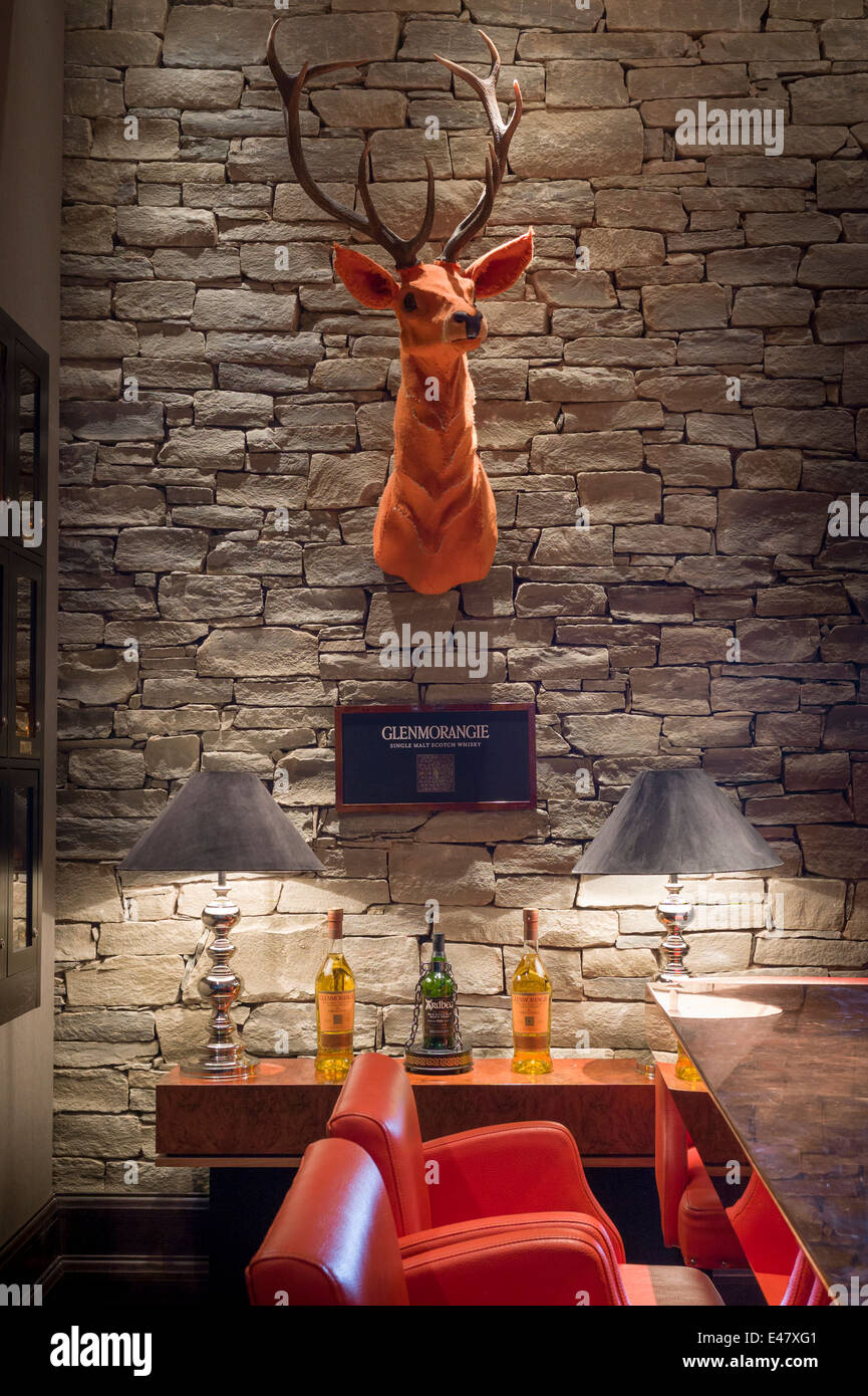 The famous Glenmorangie orange stag and single malt whisky in the Great Scots Bar at The Cameron House Hotel Glasgow, SCOTLAND Stock Photo