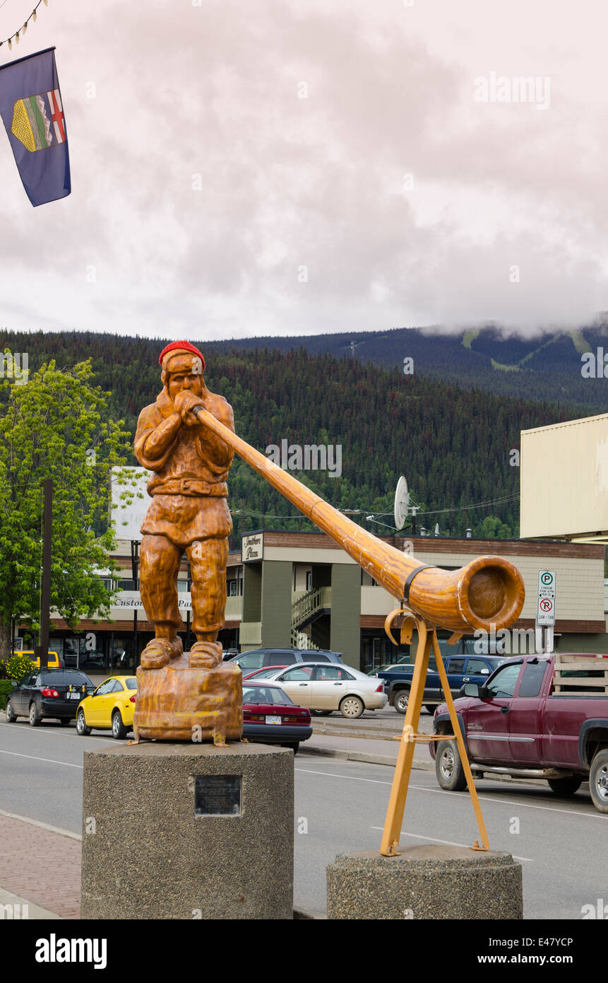 Carved wood wooden alpenhorn sculpture statue downtown Smithers, British Columbia, Canada. Stock Photo
