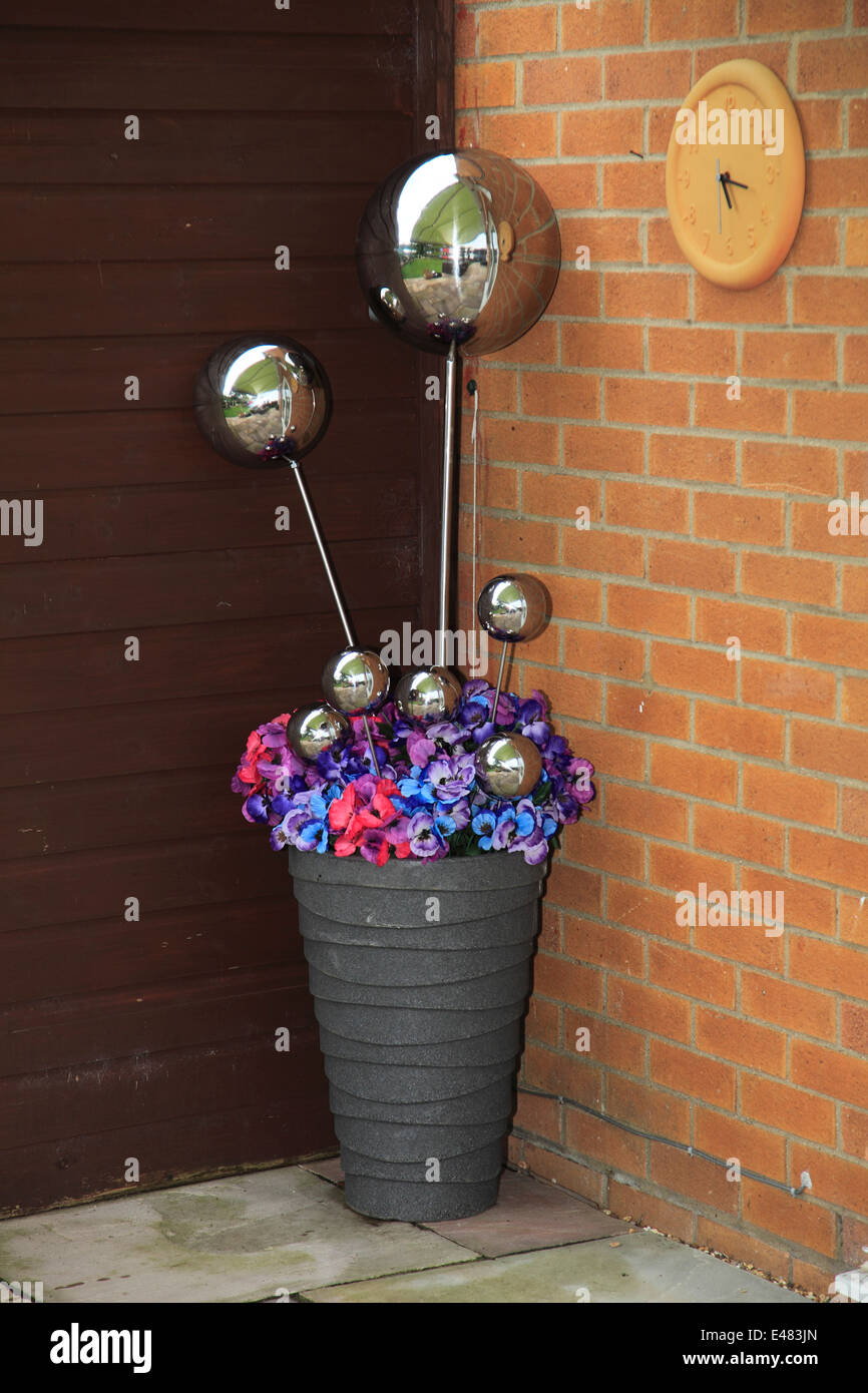 Decorative Metal Spheres In A Terracotta Plant Flower Pot