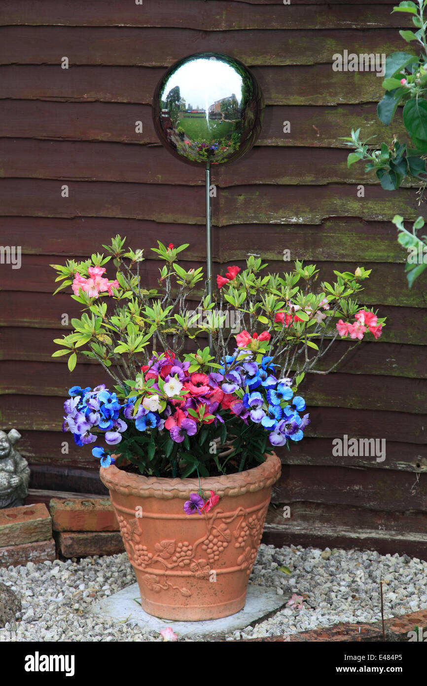 Decorative Metal Spheres In A Terracotta Plant Flower Pot Garden