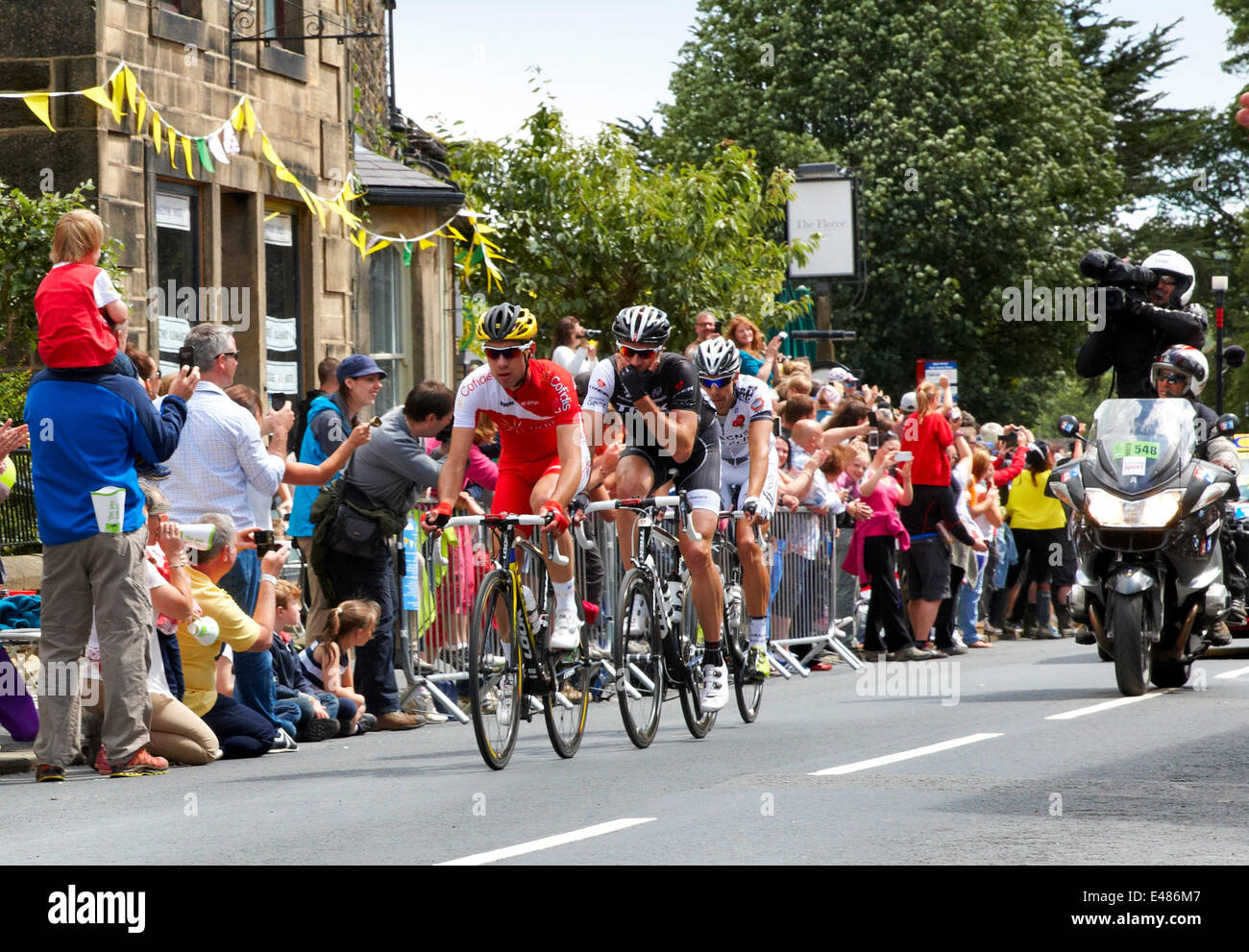 Addingham, Yorkshire. July 5th 2014. Cyclists led by Nicolas Edet of France, in the First Stage of the Tour de France pass through the Yorkshire village of Addingham, with cheering crowds and sunshine. Credit:  Christina Bollen/Alamy Live News Stock Photo
