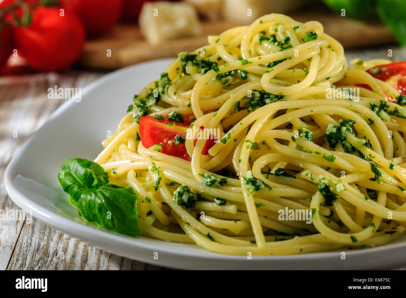 spaghetti with pesto and cherry tomatoes Stock Photo
