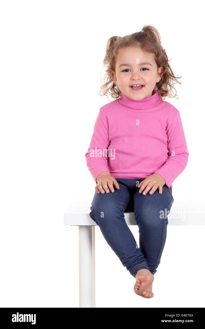 beautiful smiling girl sits at a table Stock Photo Alamy