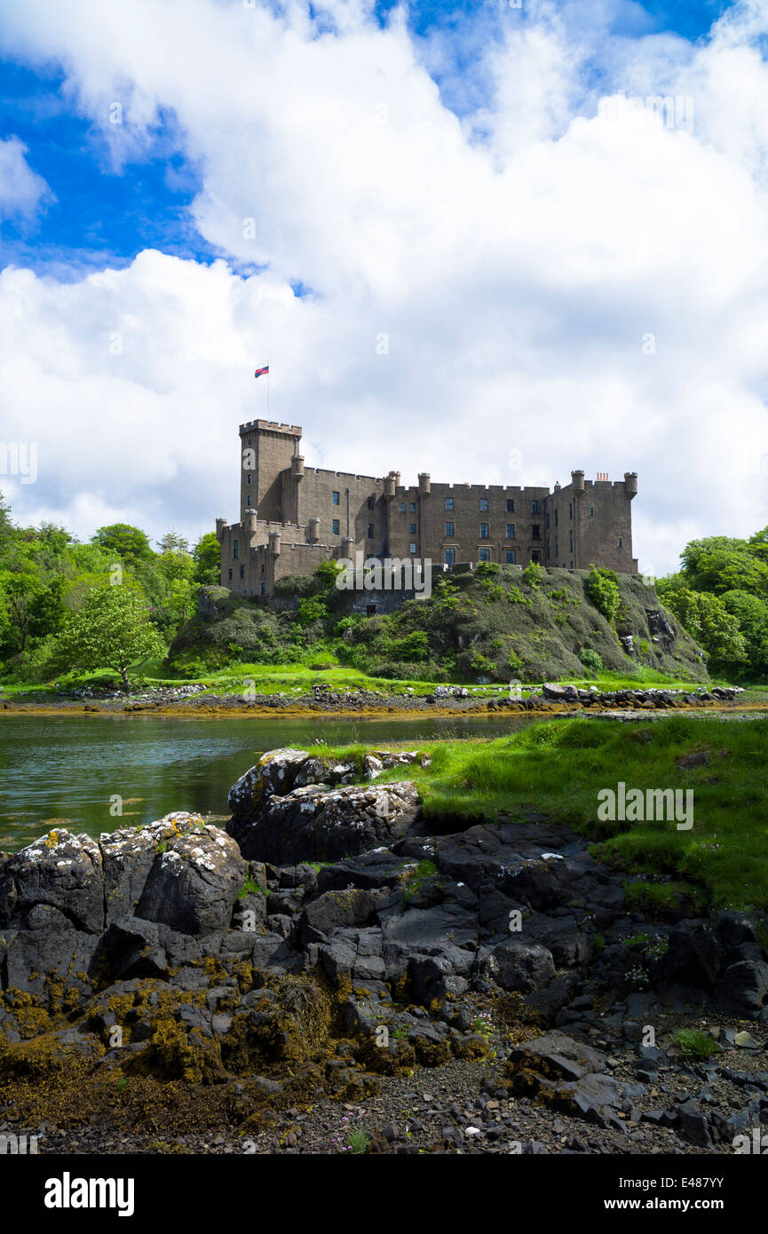 Highland fortress Dunvegan Castle, Highlands ancestral home of MacLeod clan, Dunvegan Loch sea loch on the Isle of Skye SCOTLAND Stock Photo