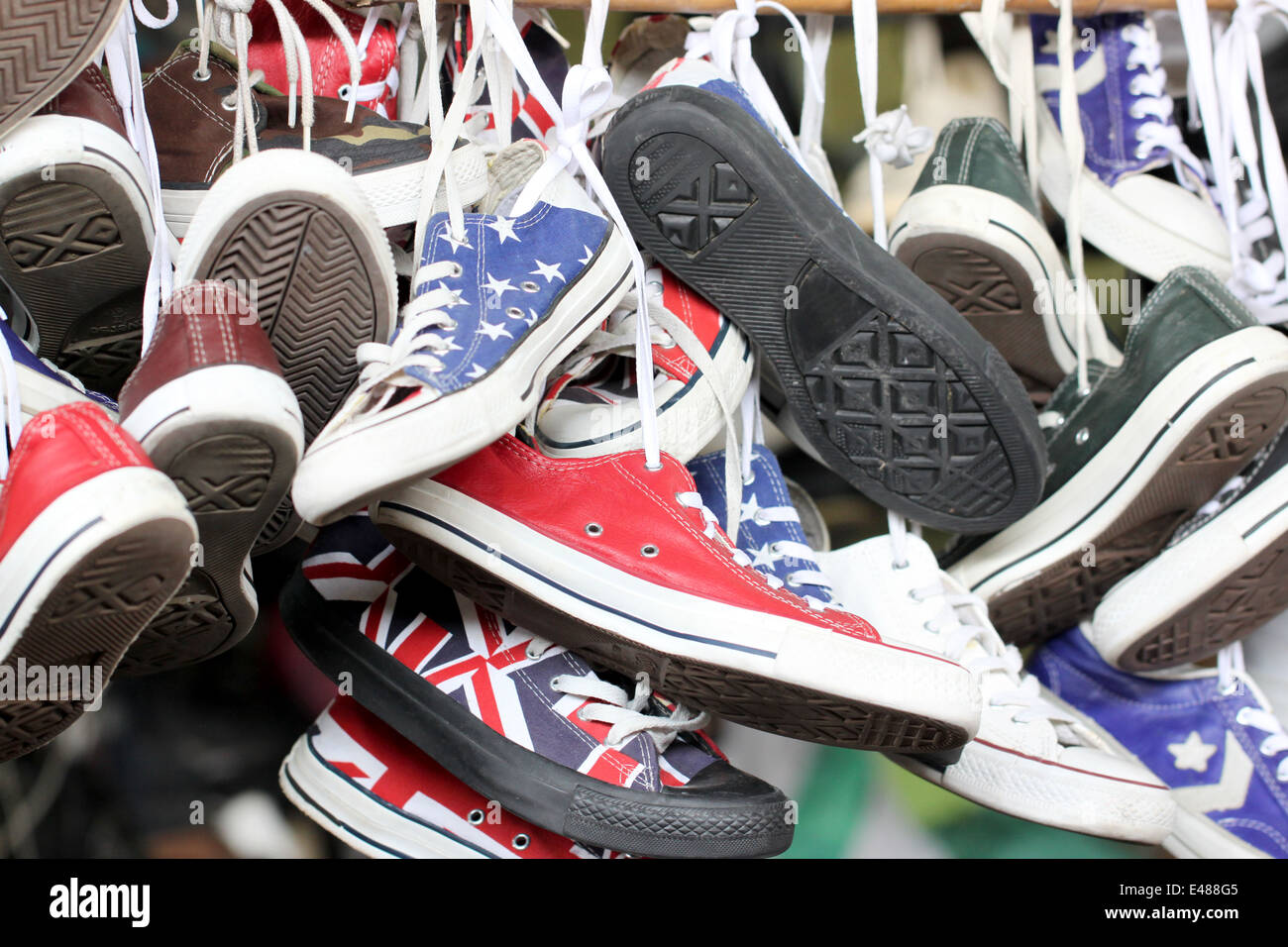 Sneakers of old shoes second hand in market shoes. Stock Photo