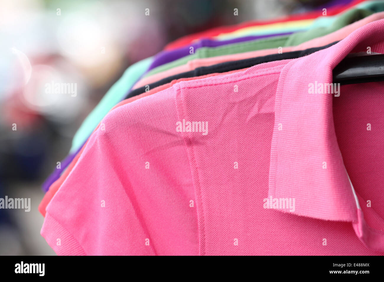 Pink shirt on a hanger in shop. Stock Photo