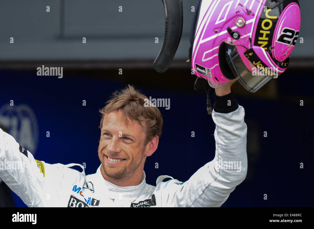 Jenson Button (GBR), McLaren F1 Team, who is wearing a pink helmet, in  memory of his father who died this year, celebrates qualifying 3rd (third)  at the British F1 Grand Prix, Silverstone,