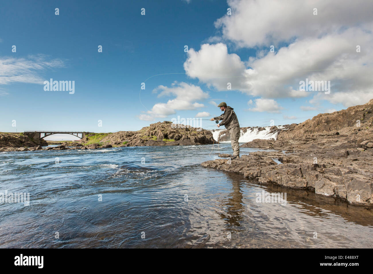 Man fishing for salmon in a beautiful surrounding Stock Photo