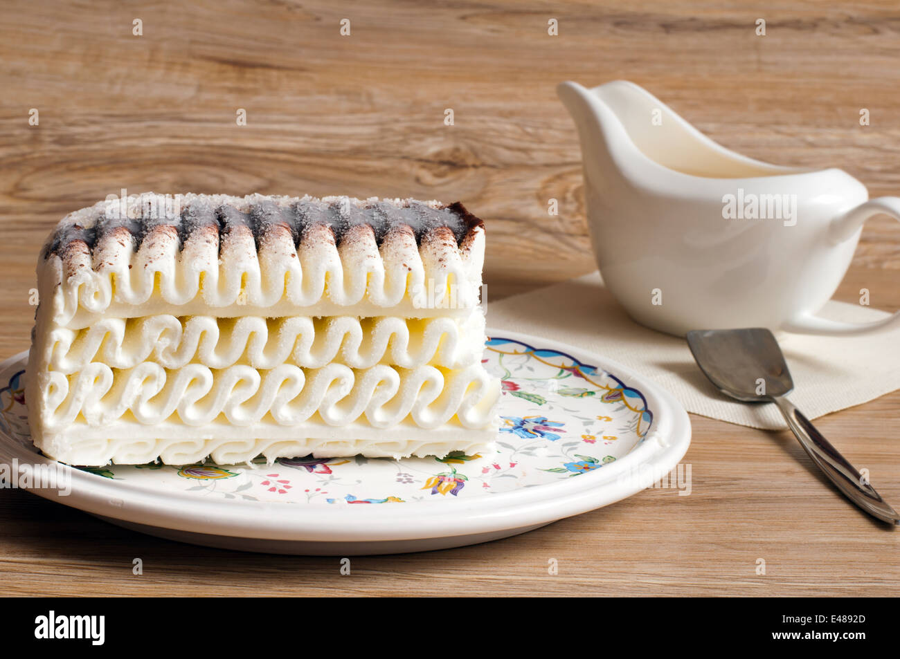 ice cake chocolate butter cream dessert piece roll big eating food ready meal treat table spoon gravy boat pattern nobody Stock Photo