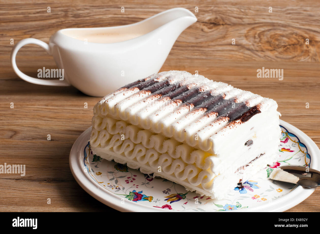 ice cake chocolate butter cream dessert piece roll big eating food ready meal treat table spoon gravy boat pattern nobody Stock Photo
