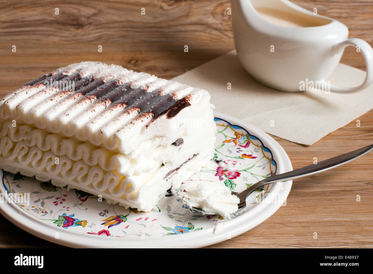 ice cake chocolate butter cream dessert piece roll big eating food ready meal treat table spoon gravy boat pattern nobody Stock Photo