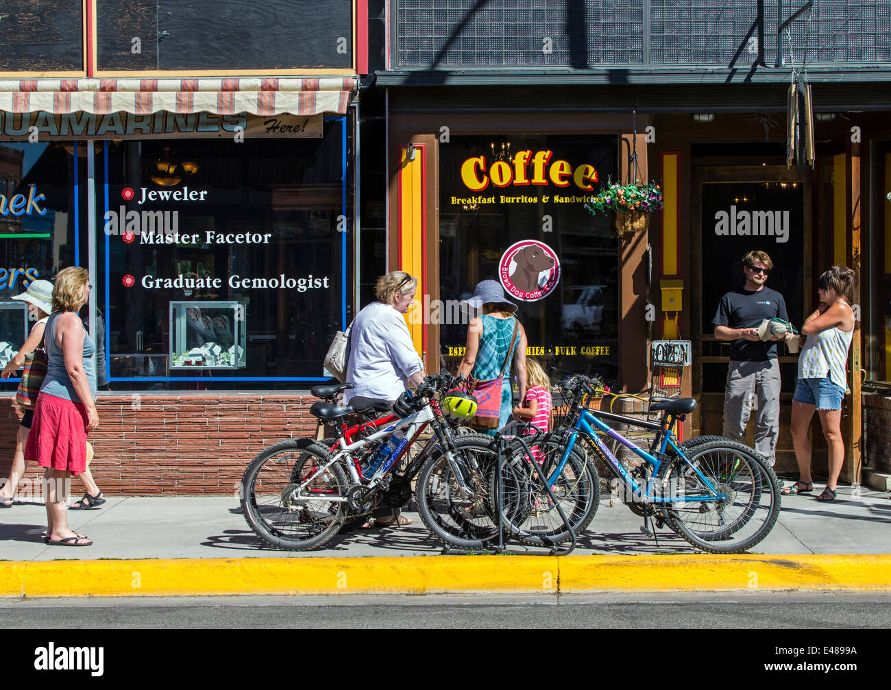 Visitors stroll by a coffee shop during the annual small town ArtWalk Festival Stock Photo