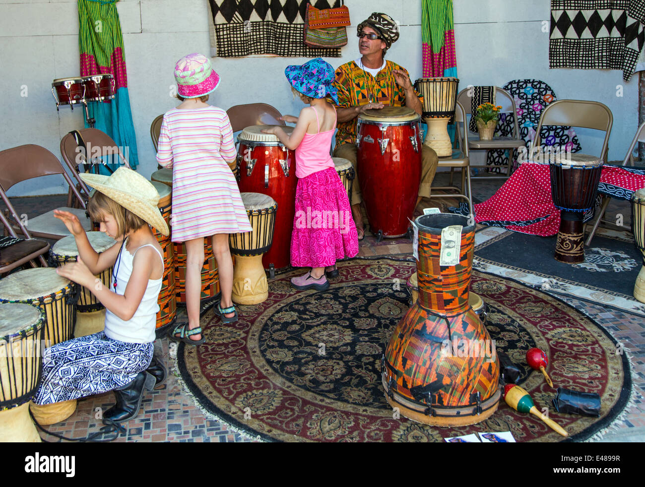 Children play drums during the annual small town ArtWalk Festival Stock Photo