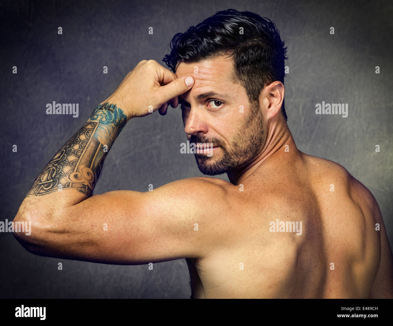 Studio portrait of tattoos on a good looking, physically fit young man Stock Photo - Alamy
