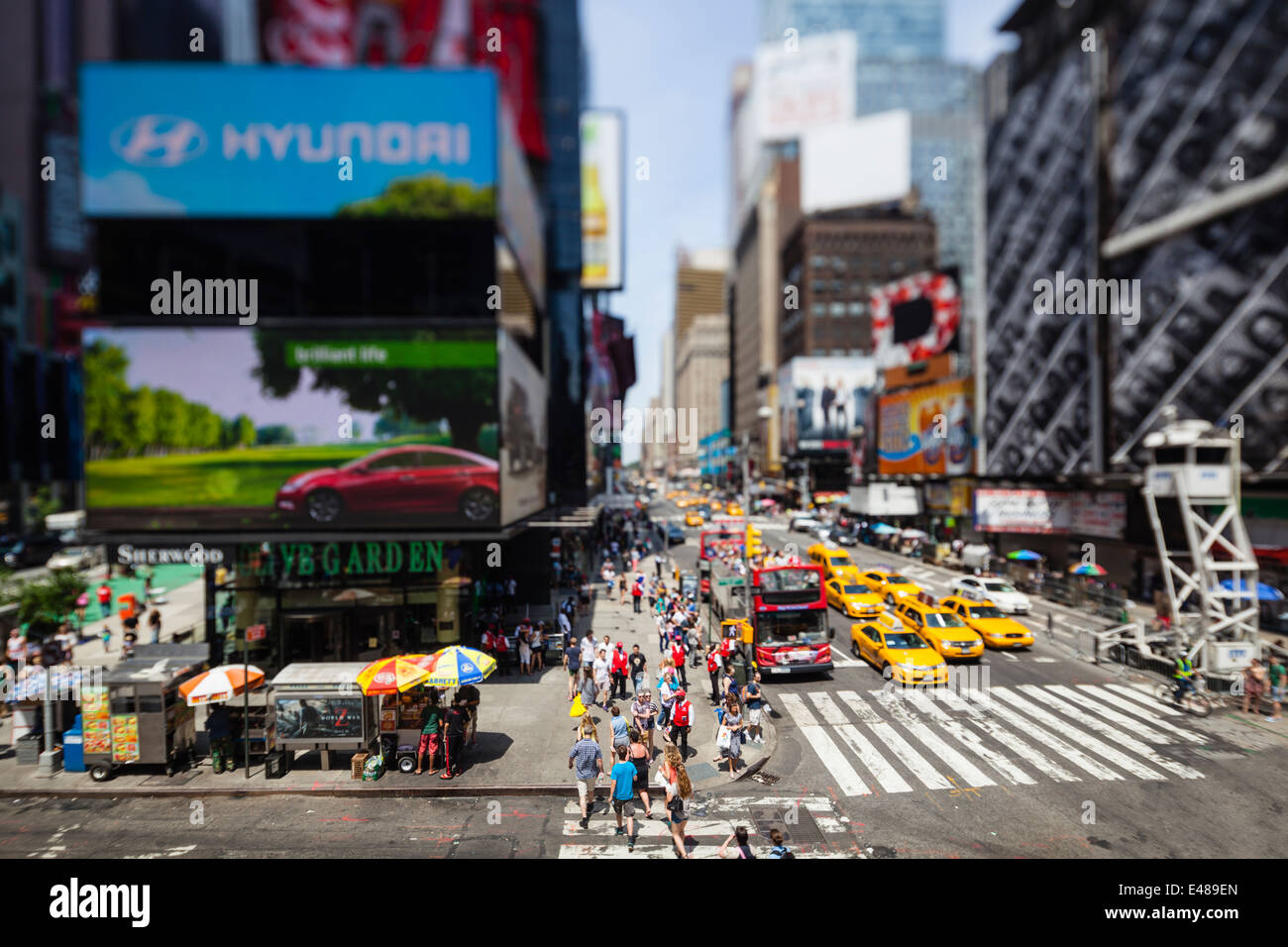 Chaotic Times Square with view along 7th Avenue in New York. Taken with a tilt and shift lens with selective fo cus Stock Photo