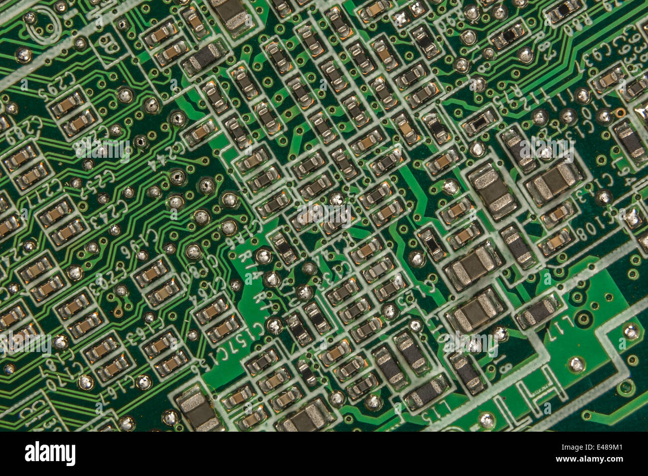 Macrophoto of surface mount (SMT) circuit board / motherboard showing