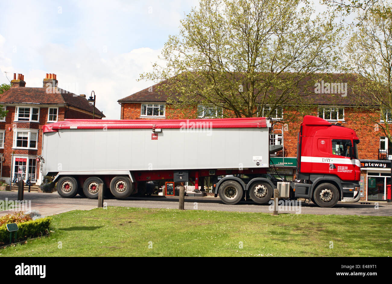 A Day Aggregates articulated tipping truck traveling through the small rural town of Tenterden in Kent, England Stock Photo