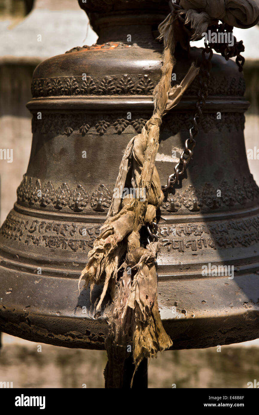 Nepal, Kathmandu, Brass Temple Bell decorated with text in Nepali script Stock Photo