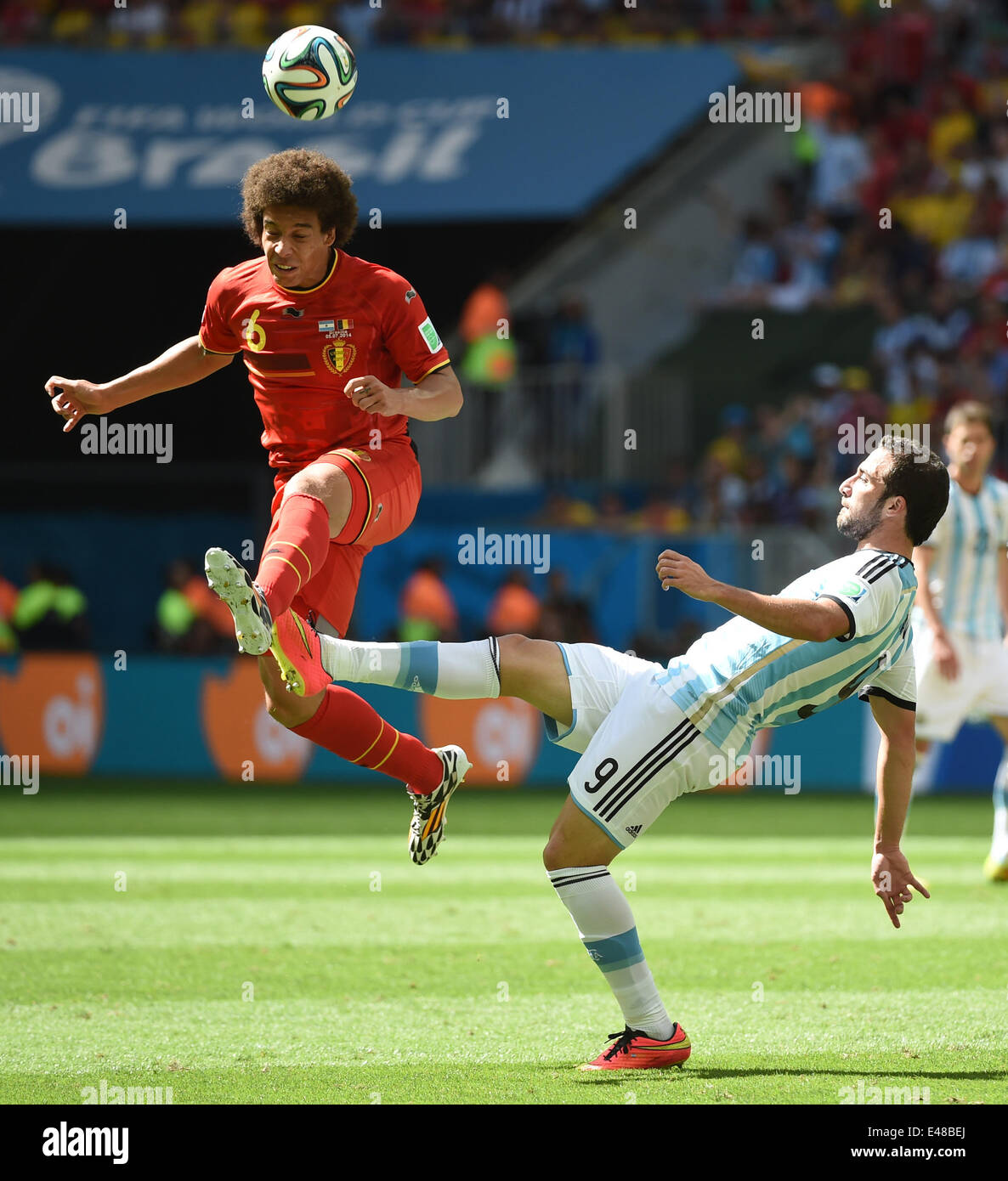 Brasilia, Brazil. 5th July, 2014. Argentina's Gonzalo Higuain vies with Belgium's Axel Witsel during a quarter-finals match between Argentina and Belgium of 2014 FIFA World Cup at the Estadio Nacional Stadium in Brasilia, Brazil, on July 5, 2014. Credit:  Liu Dawei/Xinhua/Alamy Live News Stock Photo