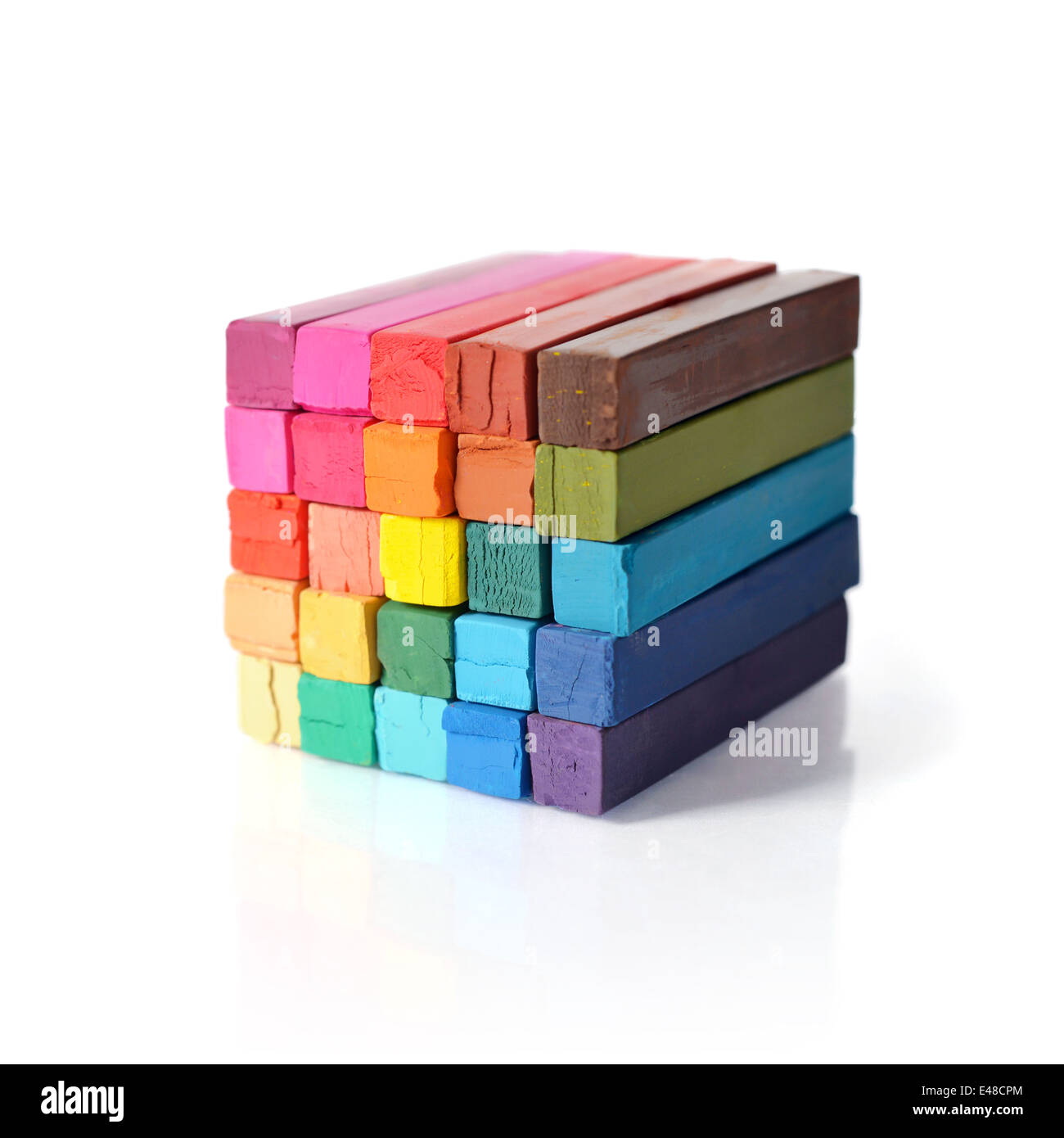 The cube from multicolored artist's pastels isolated on white background Stock Photo
