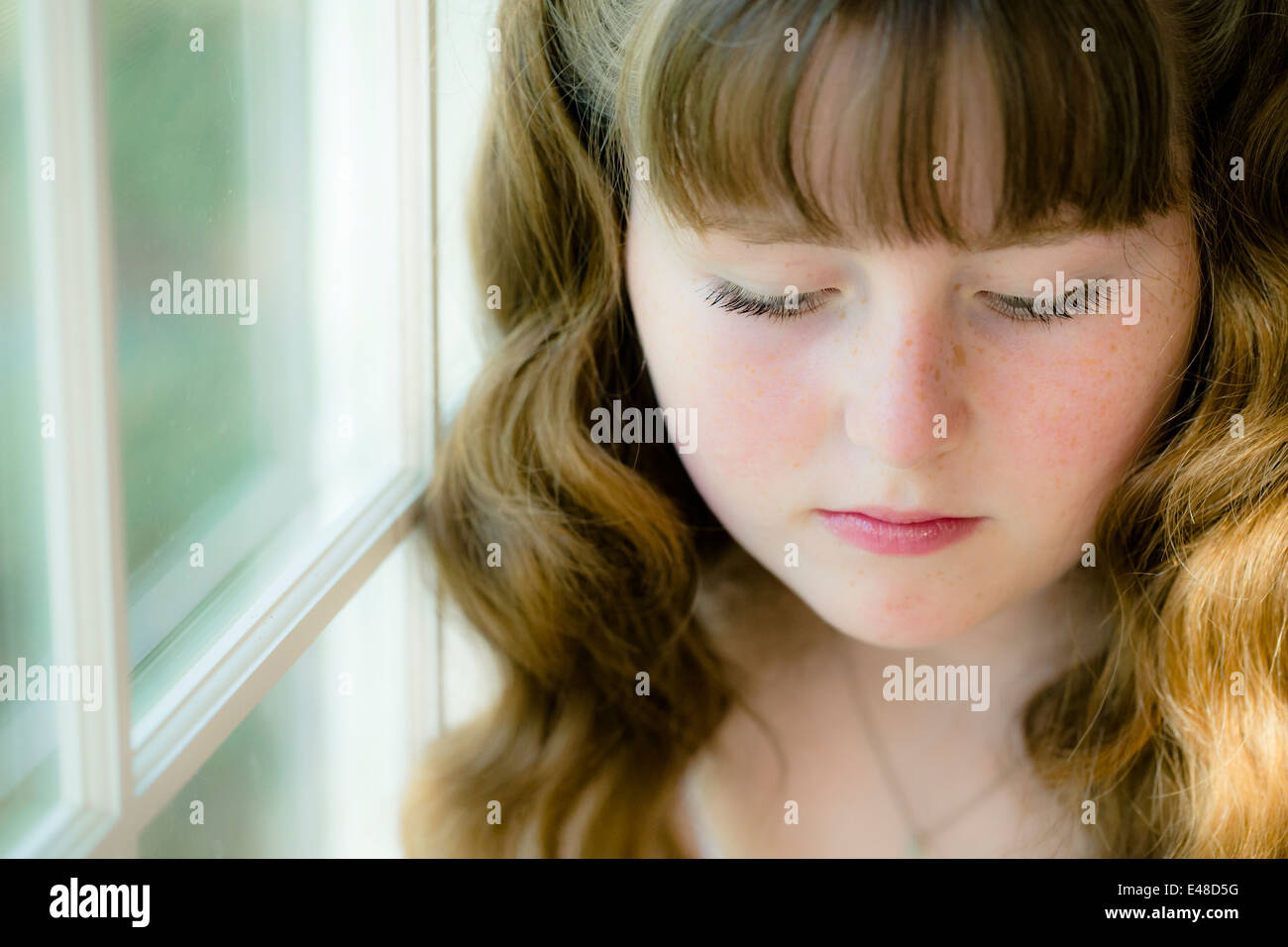 Portrait of girl (13-15) with eyes closed Stock Photo