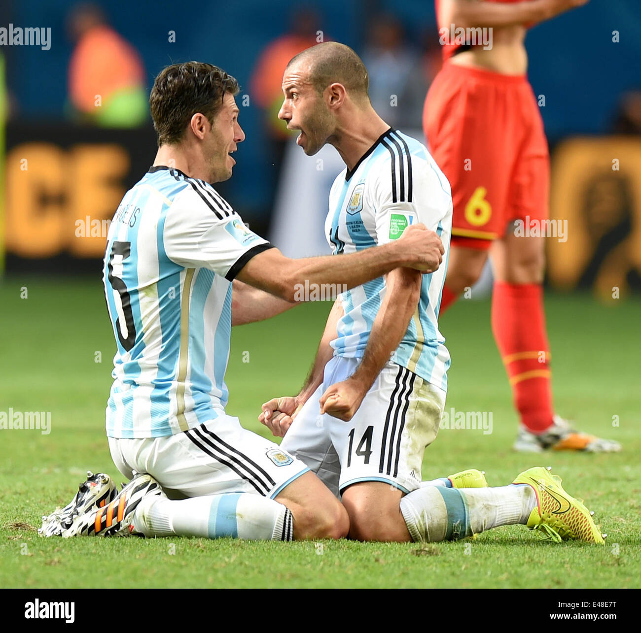 Brasilia, Brazil. 5th July, 2014. Argentina's Martin Demichelis (L) and Javier Mascherano celebrate the victory after a quarter-finals match between Argentina and Belgium of 2014 FIFA World Cup at the Estadio Nacional Stadium in Brasilia, Brazil, on July 5, 2014. Argentina won 1-0 over Belgium and qualified for the semi-finals. Credit:  Liu Dawei/Xinhua/Alamy Live News Stock Photo