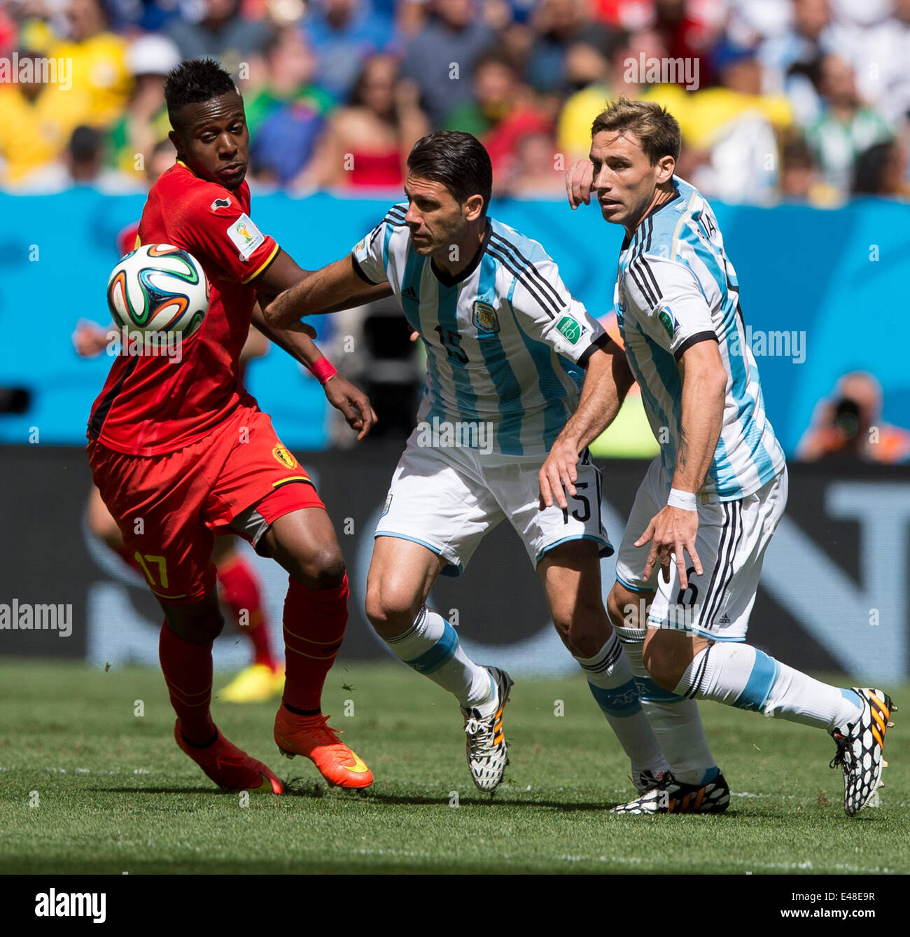 Brasilia, Brazil. 5th July, 2014. Argentina's Martin Demichelis (C) vies with Belgium's Divock Origi (L) during a quarter-finals match between Argentina and Belgium of 2014 FIFA World Cup at the Estadio Nacional Stadium in Brasilia, Brazil, on July 5, 2014. Argentina won 1-0 over Belgium and qualified for the semi-finals. Credit:  Qi Heng/Xinhua/Alamy Live News Stock Photo