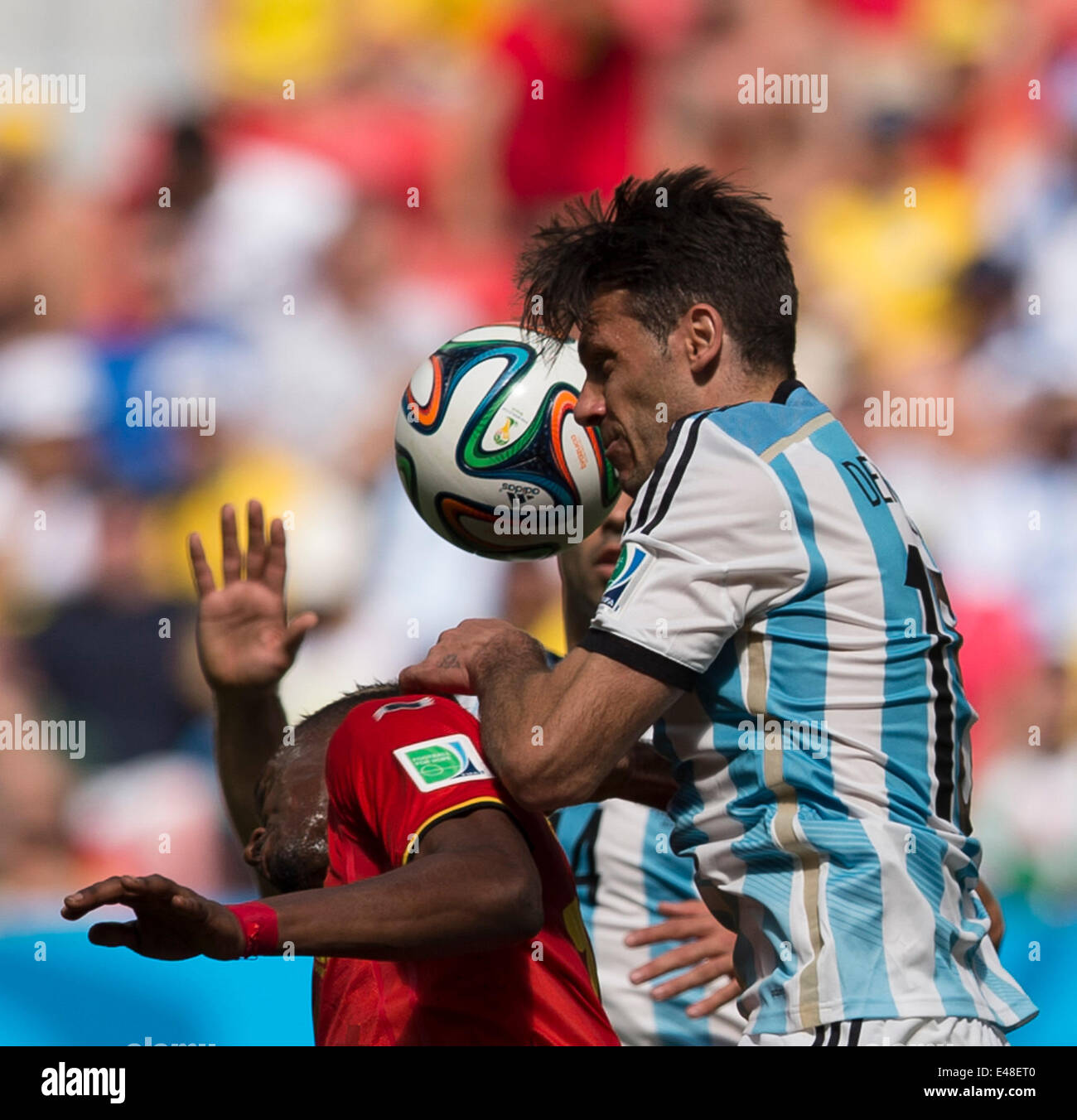 Brasilia, Brazil. 5th July, 2014. Argentina's Martin Demichelis (R) competes for a header during a quarter-finals match between Argentina and Belgium of 2014 FIFA World Cup at the Estadio Nacional Stadium in Brasilia, Brazil, on July 5, 2014. Argentina won 1-0 over Belgium and qualified for the semi-finals. Credit:  Qi Heng/Xinhua/Alamy Live News Stock Photo