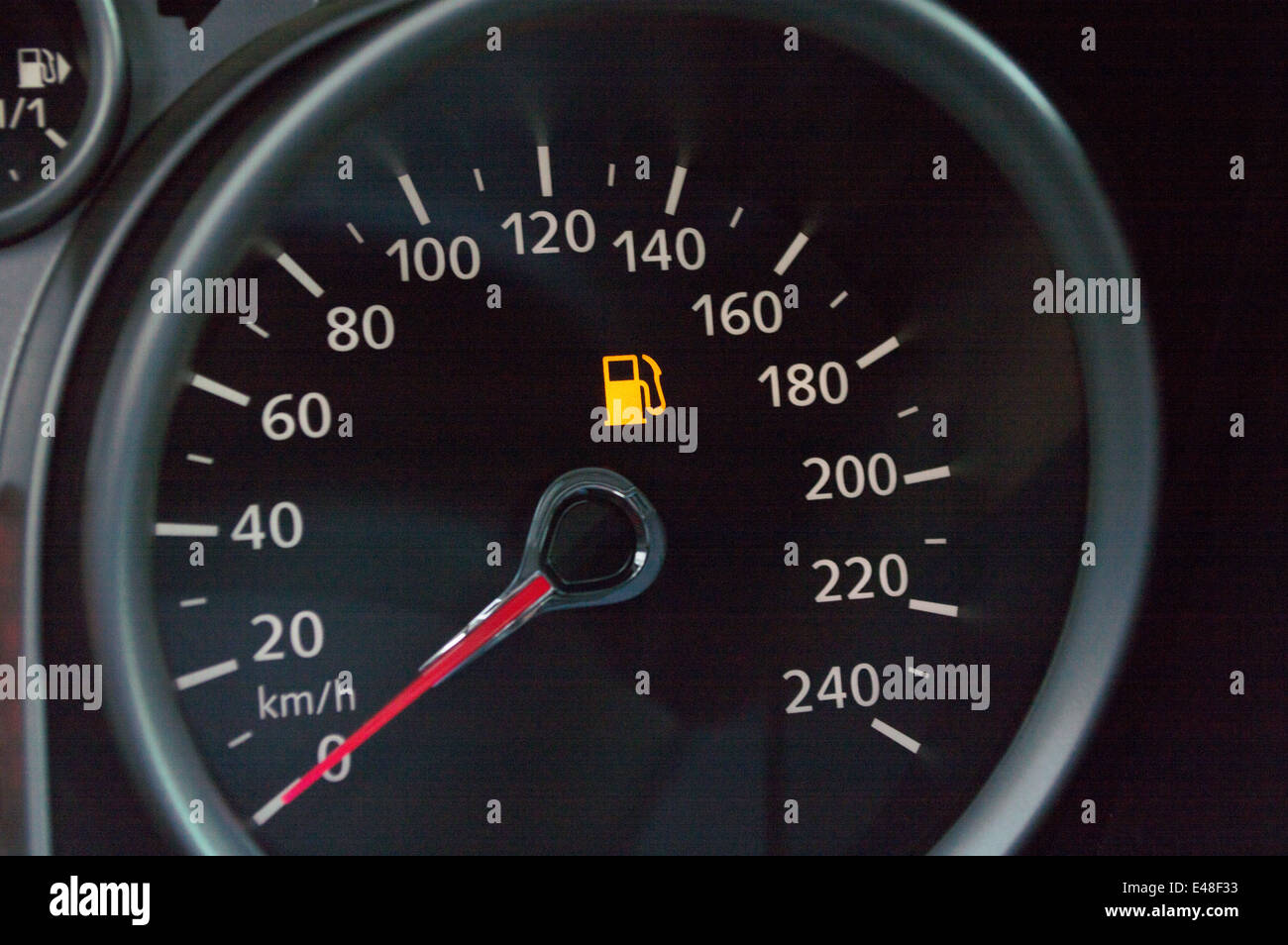 A car's gas gauge showing low on fuel Stock Photo Alamy