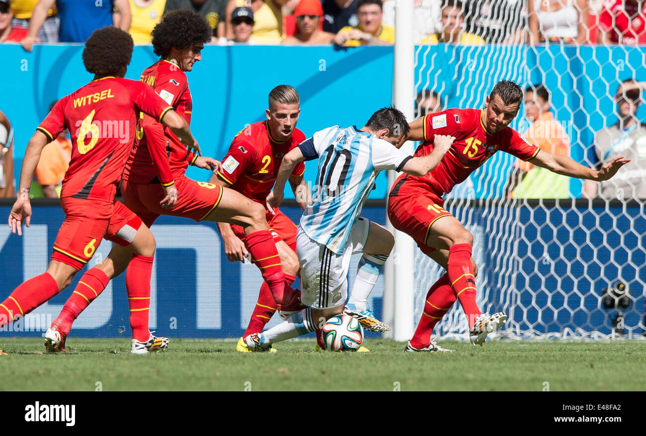 Brasilia, Brazil. 5th July, 2014. Belgium's Daniel Van Buyten (1st R), Toby Alderweireld (3rd R), Marouane Fellaini (2nd L) and Axel Witsel (1st L) defend against Argentina's Lionel Messi during a quarter-finals match between Argentina and Belgium of 2014 FIFA World Cup at the Estadio Nacional Stadium in Brasilia, Brazil, on July 5, 2014. Argentina won 1-0 over Belgium and qualified for the semi-finals. Credit:  Qi Heng/Xinhua/Alamy Live News Stock Photo