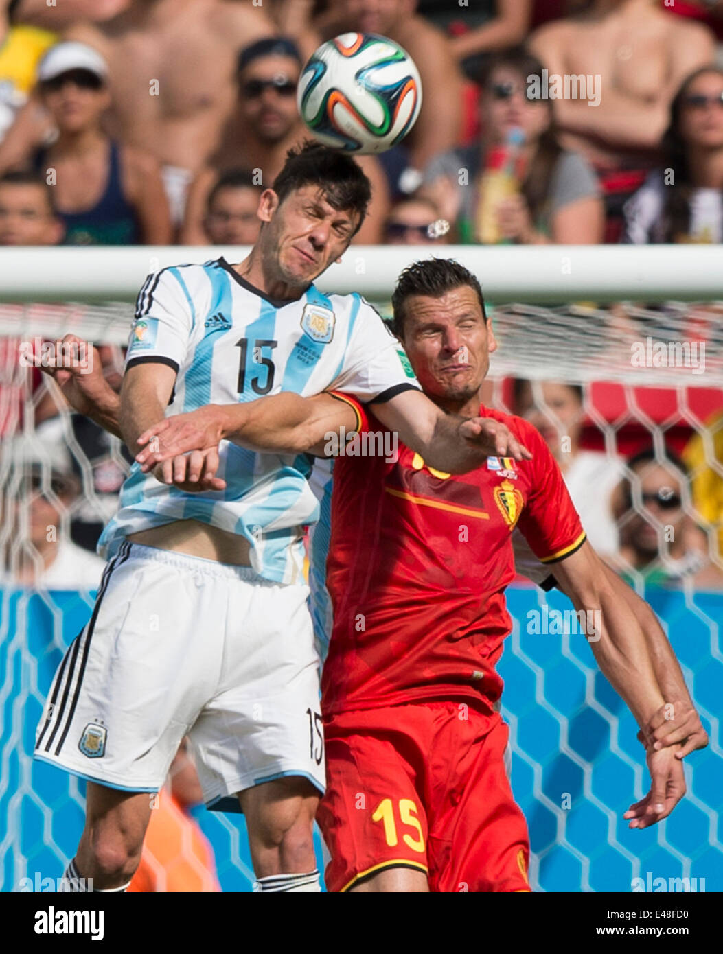 Brasilia, Brazil. 5th July, 2014. Argentina's Martin Demichelis (L) vies with Belgium's Daniel Van Buyten during a quarter-finals match between Argentina and Belgium of 2014 FIFA World Cup at the Estadio Nacional Stadium in Brasilia, Brazil, on July 5, 2014. Argentina won 1-0 over Belgium and qualified for the semi-finals. Credit:  Qi Heng/Xinhua/Alamy Live News Stock Photo