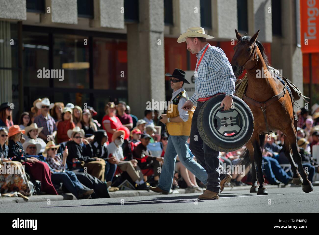 Calgary Stampede Parade 2014 During parade a wheel fall apart blocking the parade for 10 min till the the wagon has been pull over Stock Photo