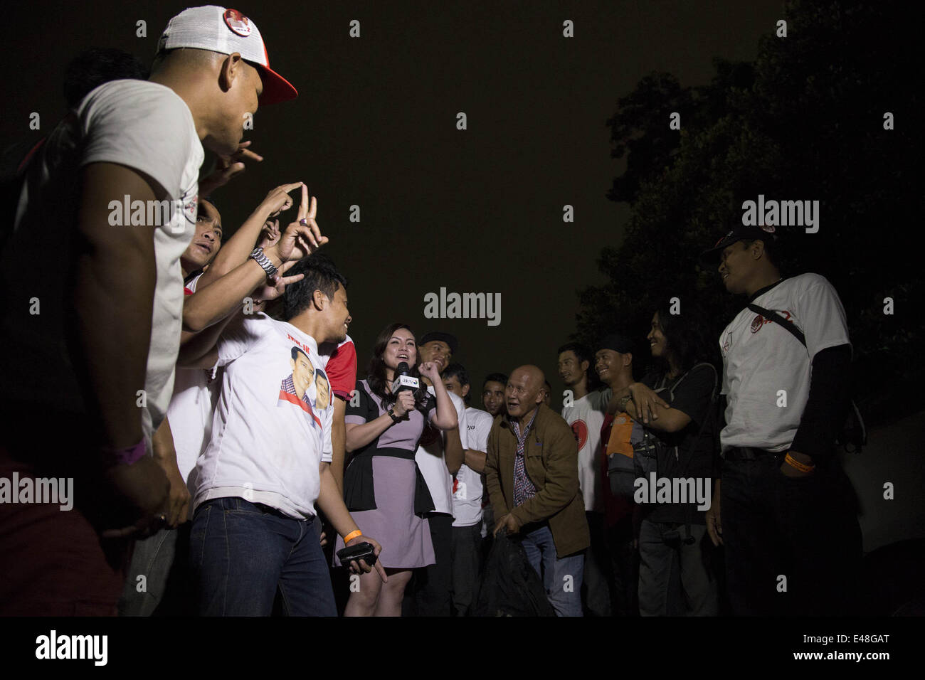 Jakarta, Jakarta, Indonesia. 5th July, 2014. A television reporter got carried away with jokowi supporters. Thousands of Jokowi supporters filled Gelora Bung Karno Stadium to hear Jokowi final big campaign in Jakarta. Credit:  Donal Husni/NurPhoto/ZUMA Wire/Alamy Live News Stock Photo