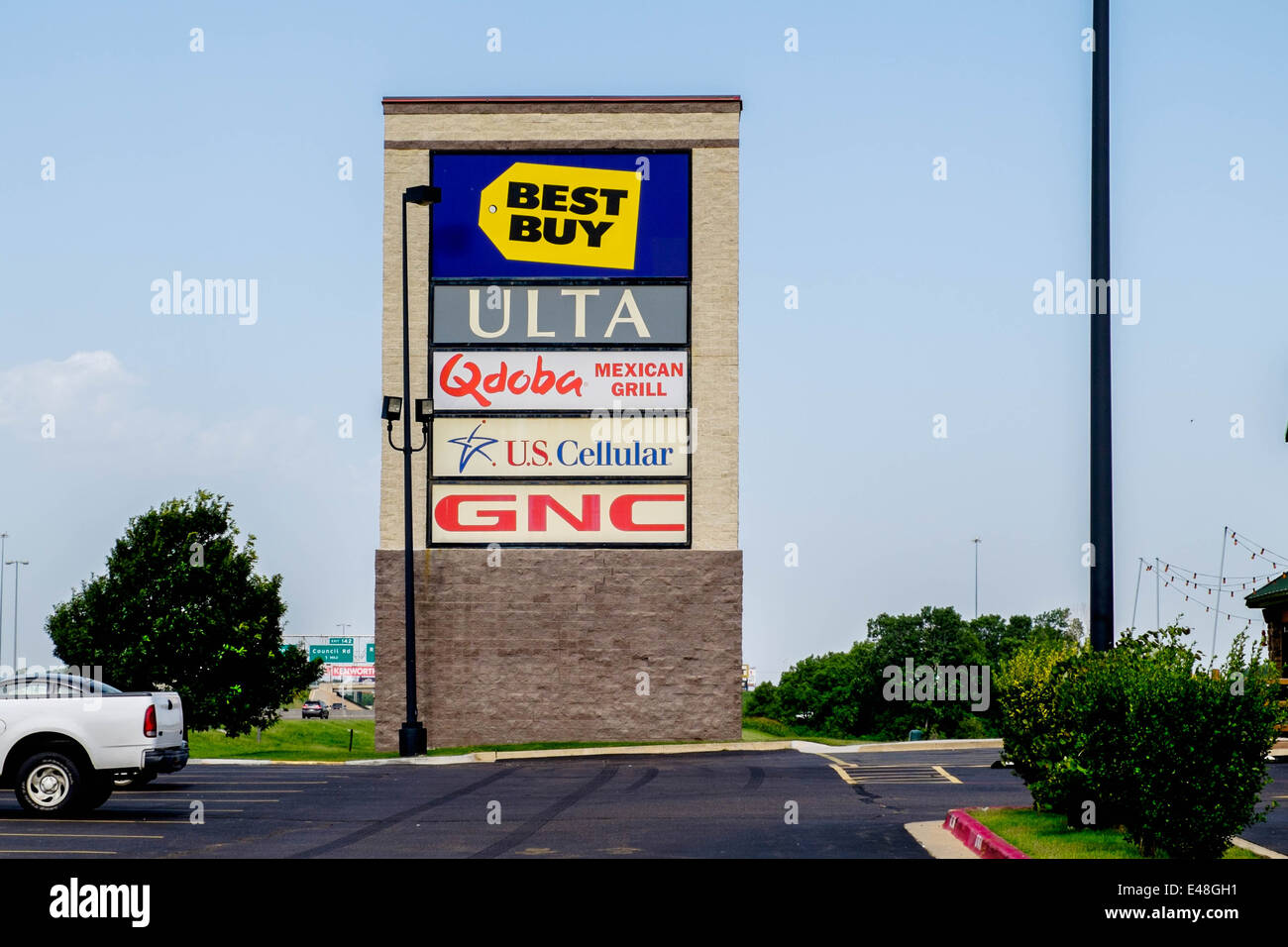 A large shopping center sign board listing businesses in a strip mall in Oklahoma City, Oklahoma, USA. Stock Photo
