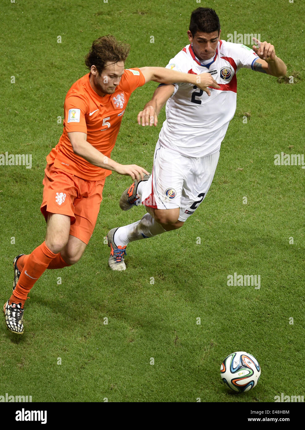Salvador, Brazil. 5th July, 2014. Netherlands' Daley Blind vies with Costa Rica's Johnny Acosta during a quarter-finals match between Netherlands and Costa Rica of 2014 FIFA World Cup at the Arena Fonte Nova Stadium in Salvador, Brazil, on July 5, 2014. Credit:  Yang Lei/Xinhua/Alamy Live News Stock Photo