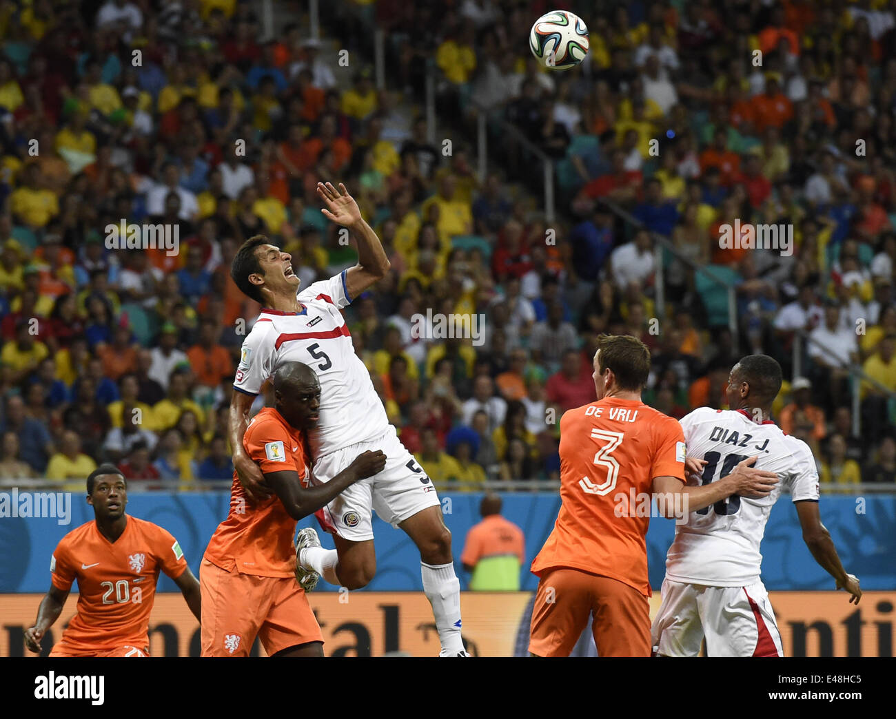 Salvador, Brazil. 5th July, 2014. Costa Rica's Celso Borges (up) jumps for a header during a quarter-finals match between Netherlands and Costa Rica of 2014 FIFA World Cup at the Arena Fonte Nova Stadium in Salvador, Brazil, on July 5, 2014. Credit:  Lui Siu Wai/Xinhua/Alamy Live News Stock Photo
