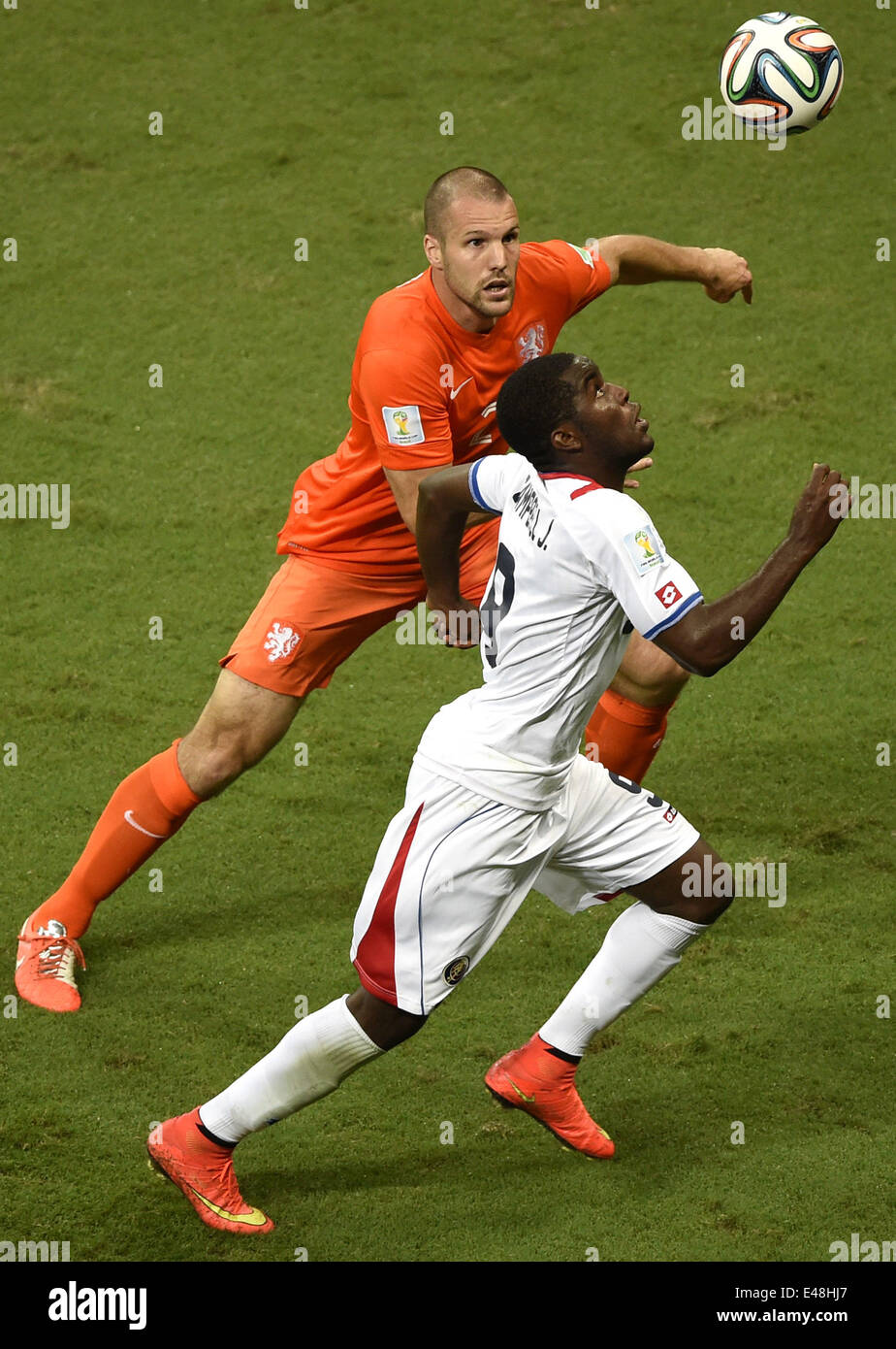 Salvador, Brazil. 5th July, 2014. Netherlands' Ron Vlaar (L) vies with Costa Rica's Joel Campbell during a quarter-finals match between Netherlands and Costa Rica of 2014 FIFA World Cup at the Arena Fonte Nova Stadium in Salvador, Brazil, on July 5, 2014. Credit:  Yang Lei/Xinhua/Alamy Live News Stock Photo