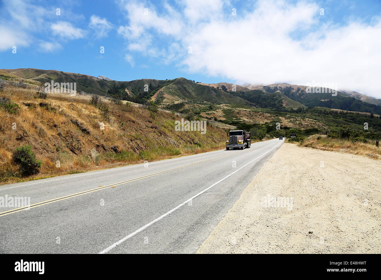 Truck driving on Route 1, Pacific Highway 101 California on the way from Big Sur, with stunning views of the scenery and ocean Stock Photo