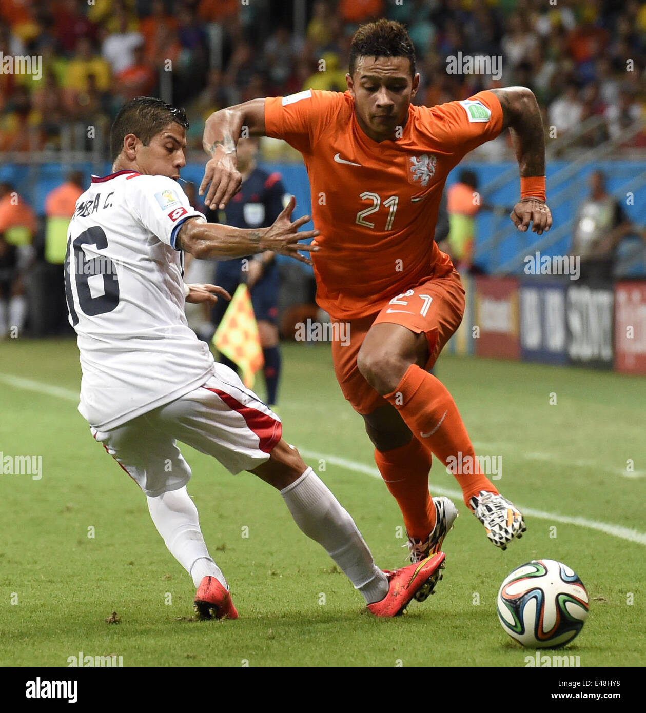 Salvador, Brazil. 5th July, 2014. Netherlands's Memphis Depay vies with Costa Rica's Christian Gamboa during a quarter-finals match between Netherlands and Costa Rica of 2014 FIFA World Cup at the Arena Fonte Nova Stadium in Salvador, Brazil, on July 5, 2014. Credit:  Lui Siu Wai/Xinhua/Alamy Live News Stock Photo
