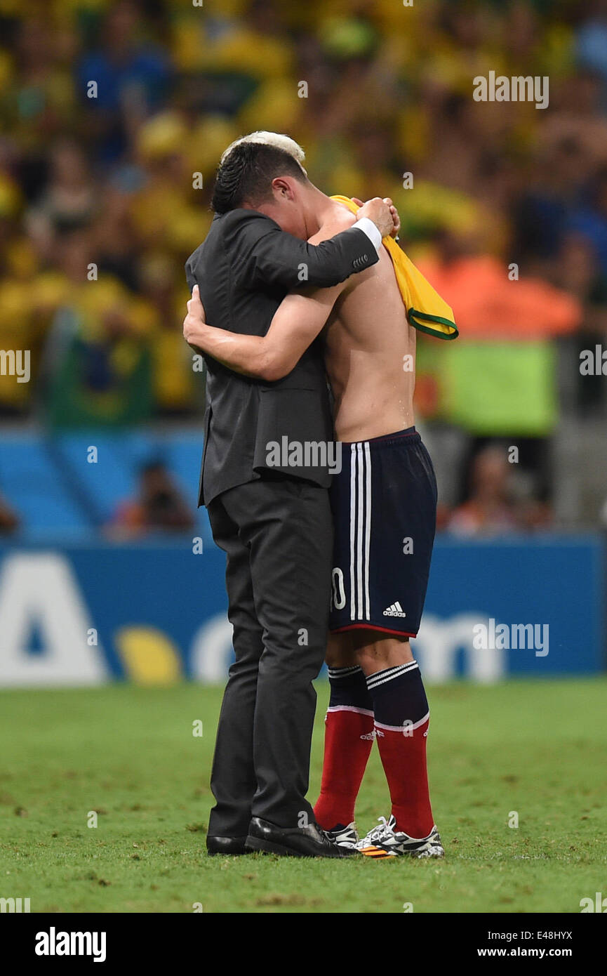 Fortaleza, Brazil. 04th July, 2014. Head coach Jose Pekerman (L) of Colombia hugs his player James Rodriguez after the FIFA World Cup 2014 quarter final match soccer between Brazil and Colombia at the Estadio Castelao in Fortaleza, Brazil, 04 July 2014. Credit:  Action Plus Sports/Alamy Live News Stock Photo