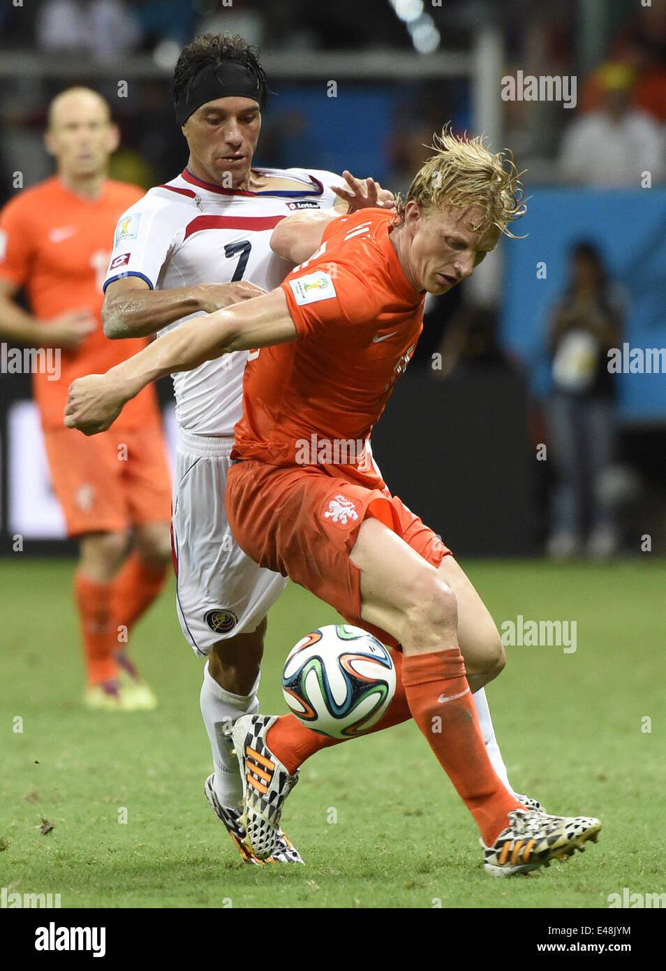 Salvador, Brazil. 5th July, 2014. Netherlands's Dirk Kuyt vies with Costa Rica's Christian Bolanos during a quarter-finals match between Netherlands and Costa Rica of 2014 FIFA World Cup at the Arena Fonte Nova Stadium in Salvador, Brazil, on July 5, 2014. Netherlands won 4-3 on penalties over Costa Rica after a 0-0 tie and qualified for semi-finals on Saturday. Credit:  Lui Siu Wai/Xinhua/Alamy Live News Stock Photo
