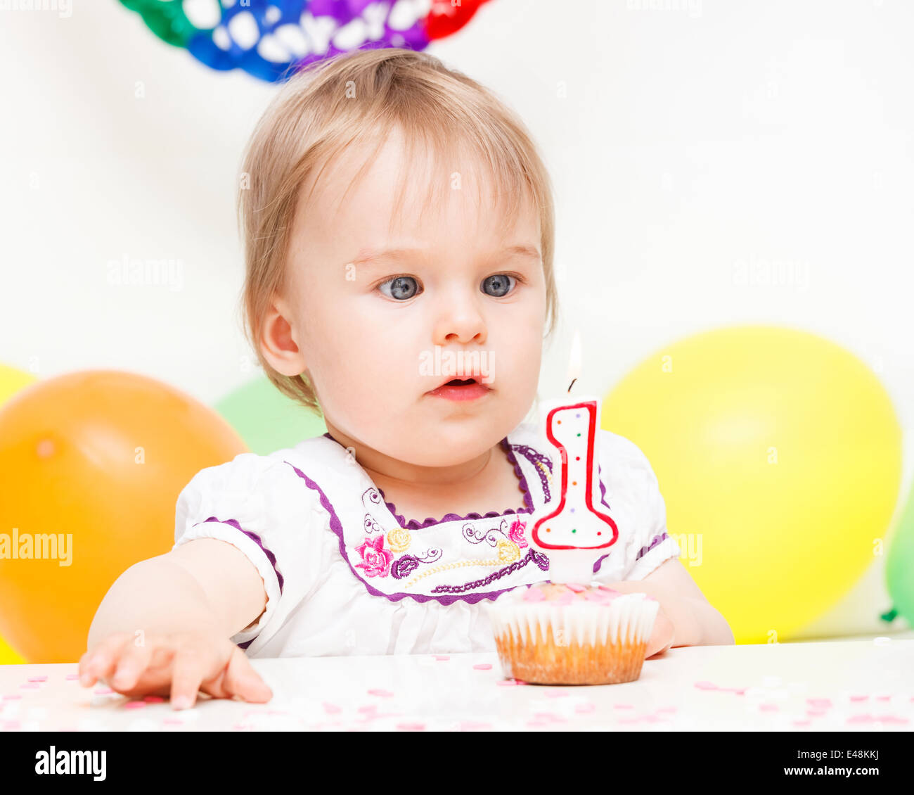 Little girl celebrating first birthday Stock Photo - Alamy
