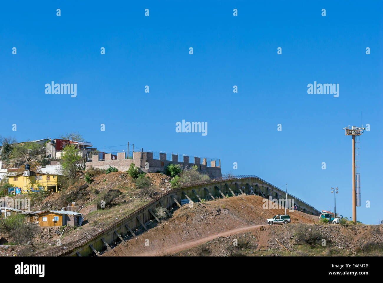 US border fence near downtown Nogales, Arizona USA, looking south into Nogales, Sonora, Mexico Stock Photo
