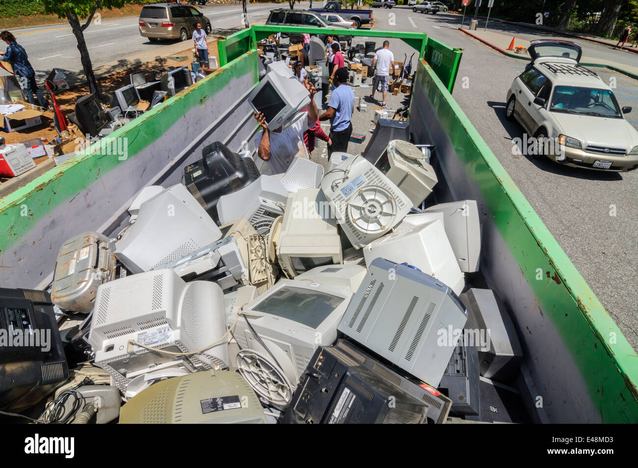 Volunteers helping at electronic waste collection community