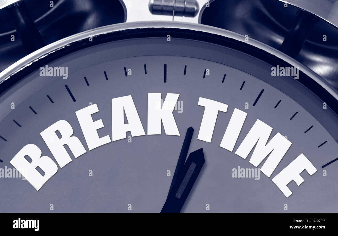 Break Time on a clock face great concept for short breaks during a busy schedule or presentation. Stock Photo