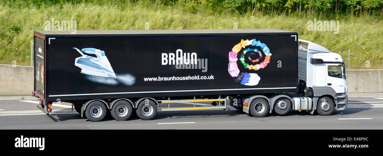 Lorry trailer advertising Braun household appliances behind a white truck Stock Photo
