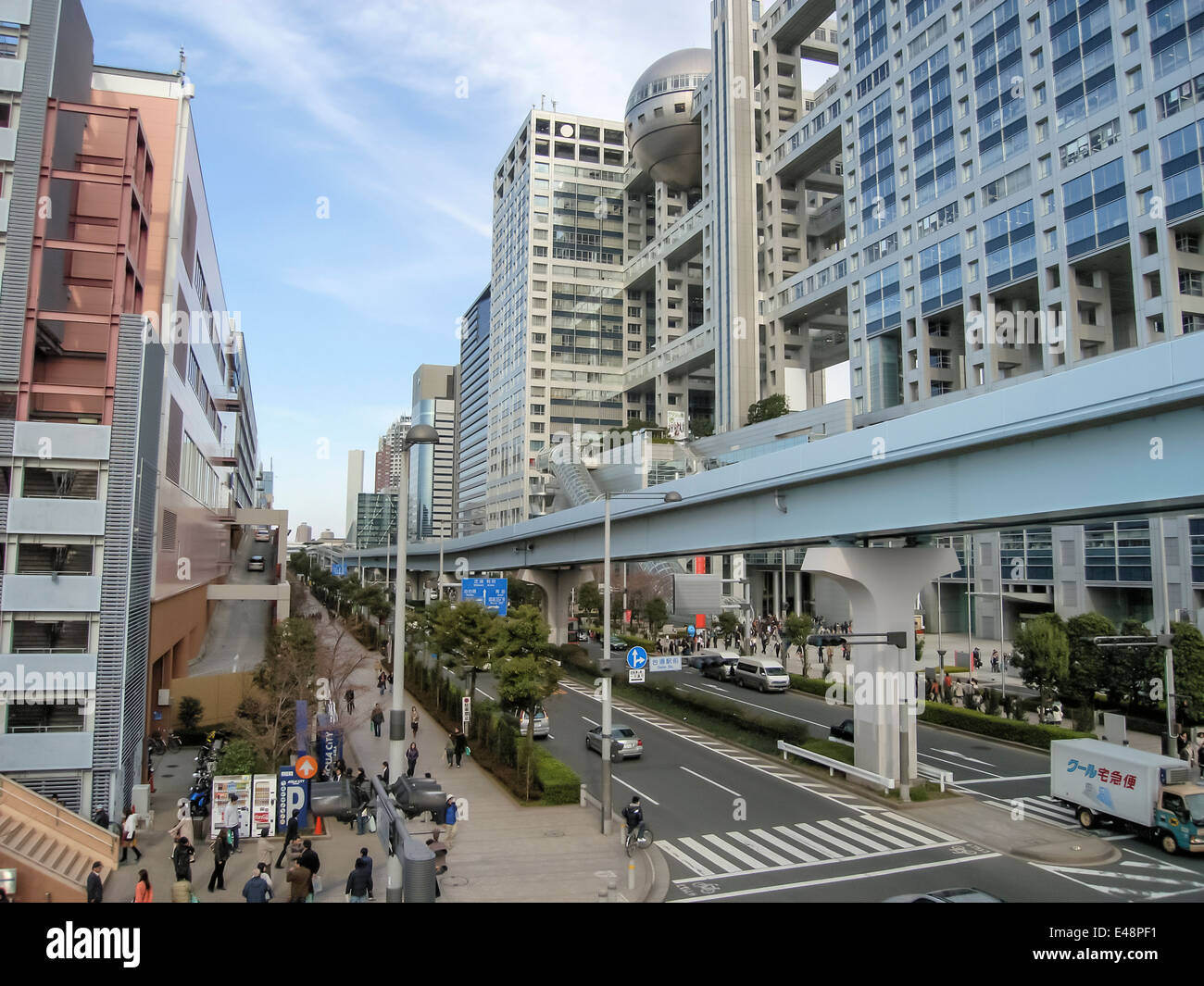 Elevated railway track of Tokyo's 'New Transit Waterfront Line' (Yurikamome) passing by the Fuji TV building in Obaida (Tokyo). Stock Photo