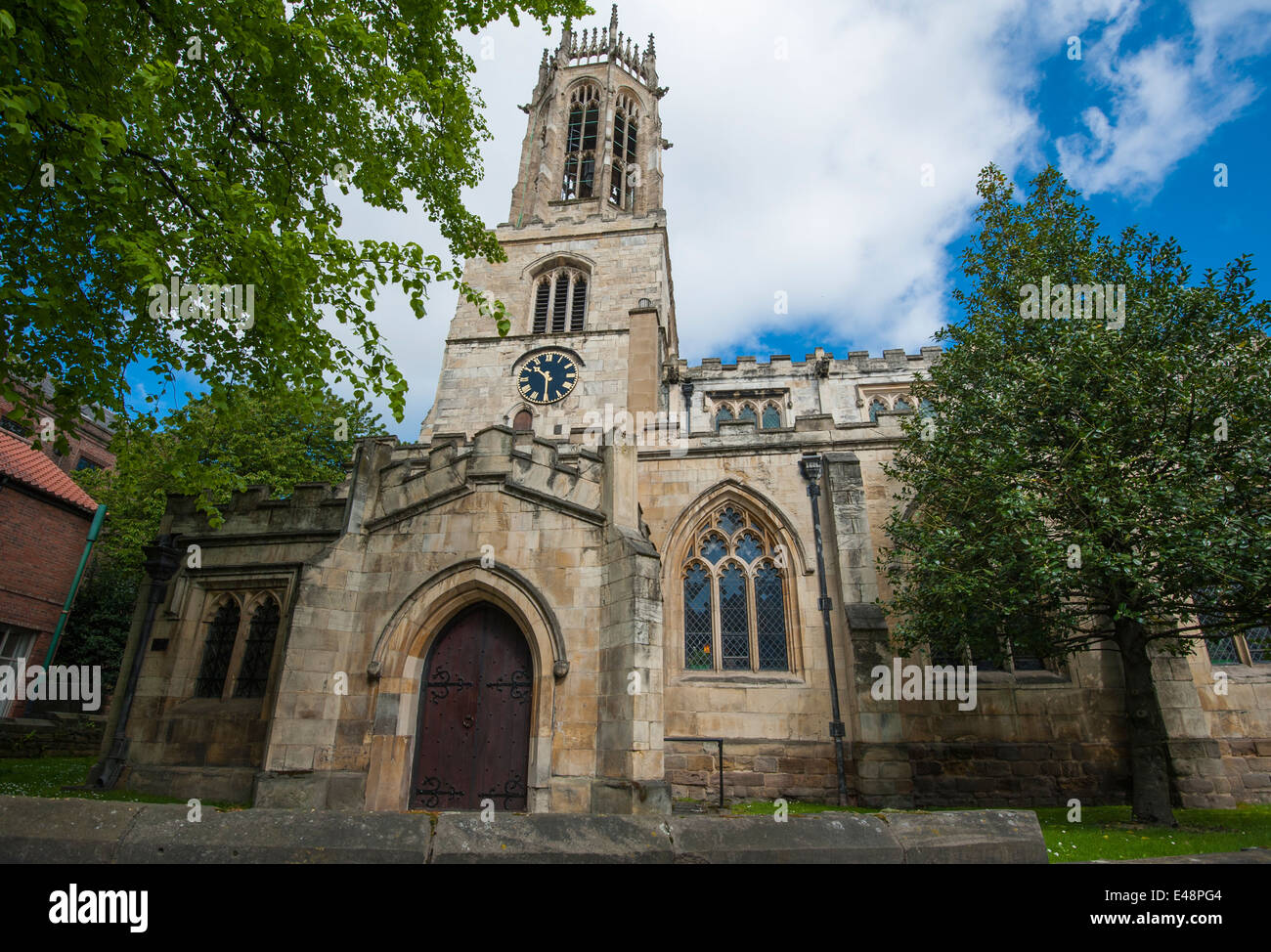 Old medieval All Saints church in english city of York with clock and octagonal lantern tower Stock Photo