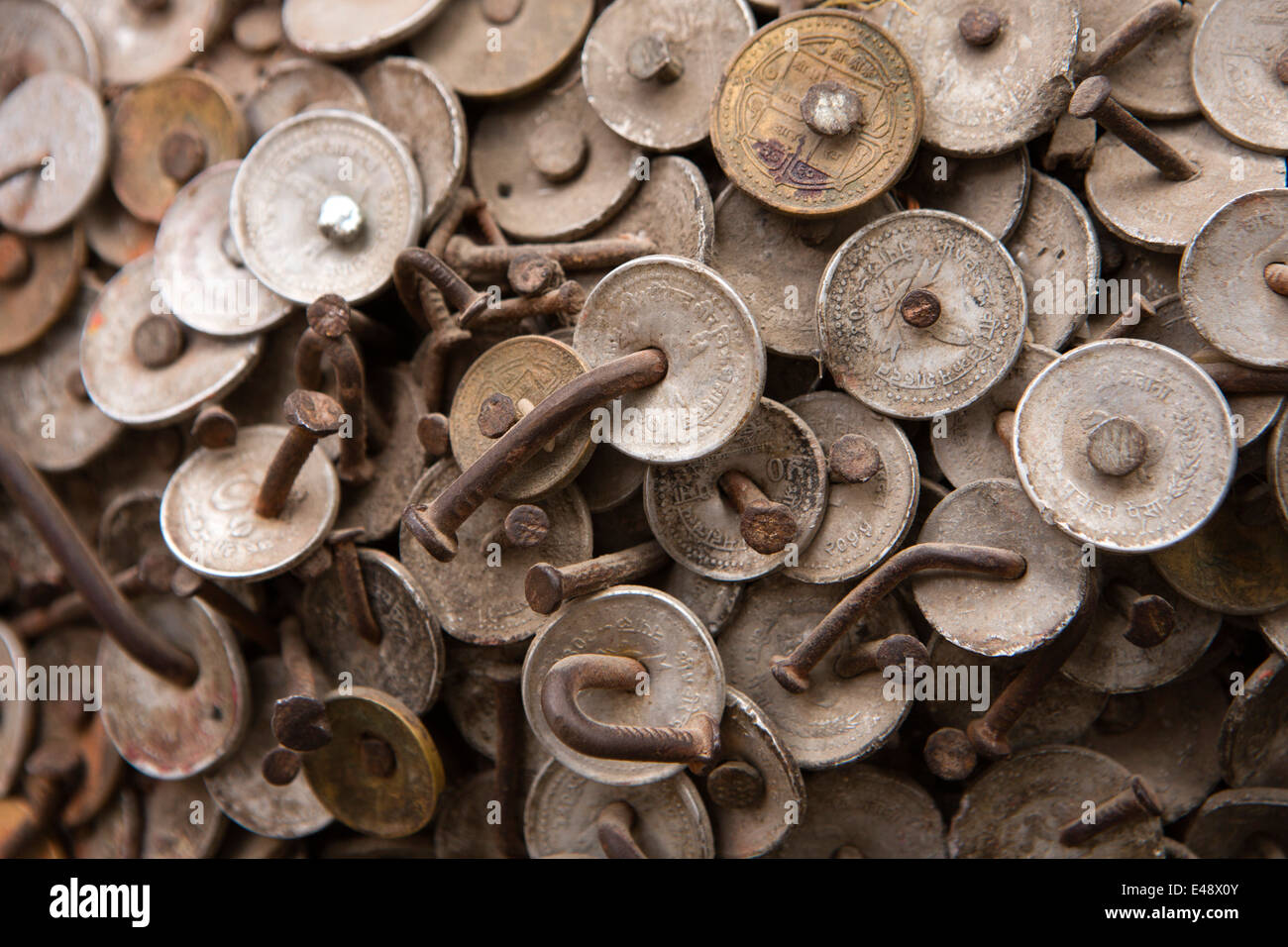 Nepal, Kathmandu, Bangemudha Square, Vaisha Dev Toothache God tree, coins nailed to cure tooth ache Stock Photo